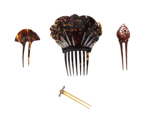 An antique tortoiseshell hair comb, 19cms high ; together with three smaller similar (4).