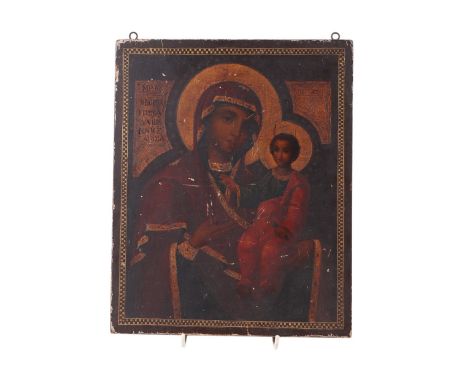 A 19th century polychrome Russian icon, Madonna and Child, painted on a wooden panel with script and armorial wax seal impres