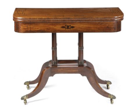 A Regency mahogany card table in the manner of George Oakley, inlaid with ebonised Greek key stringing, the swivel fold-over 