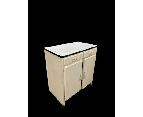A mid-century vintage kitchen cupboard, the rectangular enamel top above two short drawers with cupboards beneath, 77cms wide