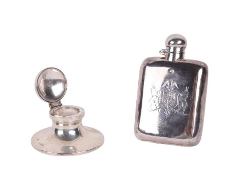 A small silver hip flask with engraved armorial decoration, 10.5cms high, 93g; together with a silver Capstan inkwell (2). 