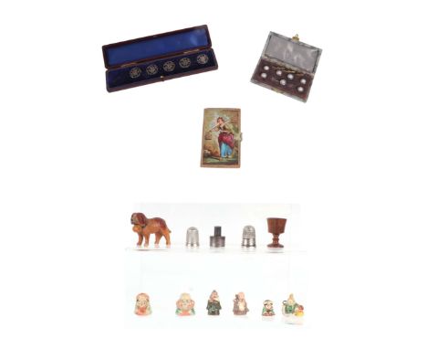 A boxed set of Opalite dress buttons; together with five silver buttons; two silver thimbles; miniature Japanese pottery figu