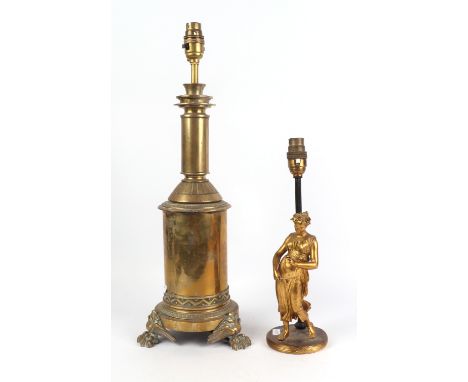 A figural gilt bronze / brass lamp base, 31cms high; together with a Victorian brass lamp base with lion paw feet, 50cms high