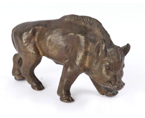 A bronze figure of a wild boar, 9cms long.