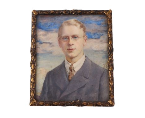 An early 20th century portrait miniature on ivory depicting a young gentleman wearing a grey suit, framed & glazed, 7 by 8.5c