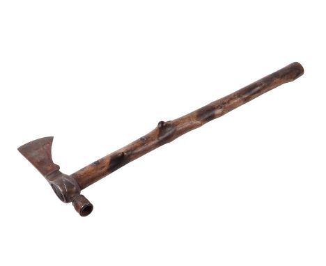 A North American Indian Tomahawk axe, 59cms long.