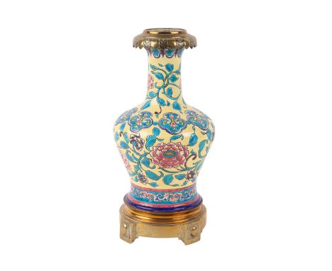 A Chinese baluster vase with chrysanthemum flowers on a yellow ground and bronze collar and foot, 28cms high.