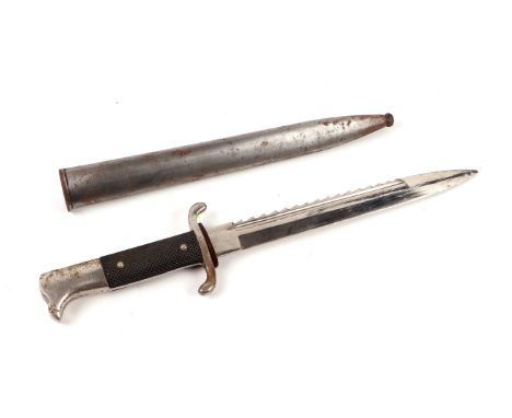 A German WKC Solingen saw back bayonet in steel scabbard, 40cms long.