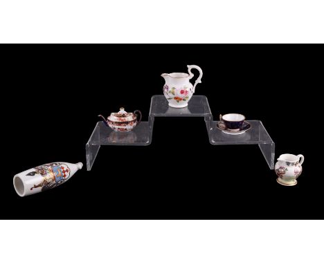 A group of miniature ceramics to include a Royal Crown Derby teapot; a Royal Crown Derby cup and saucer and a German porcelai