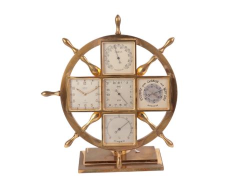 An Angelus ship's wheel multi-dial clock, thermometer, barometer hydrometer, 17cms high.Condition ReportOne handle on the shi