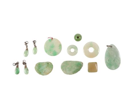 A quantity of Chinese jade / hardstone pendants and discs.