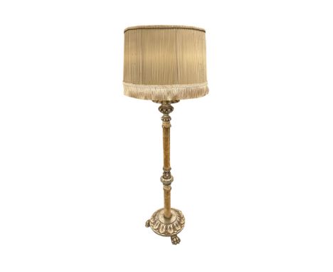 A French giltwood and fabric standard lamp on lion paw feet, 130cm high.