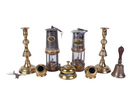 A Pattison's Lamps GPO Miner's lamp; an E. Thomas & Williams Ltd Miner's lamp; a pair of brass candlesticks; a brass counter 