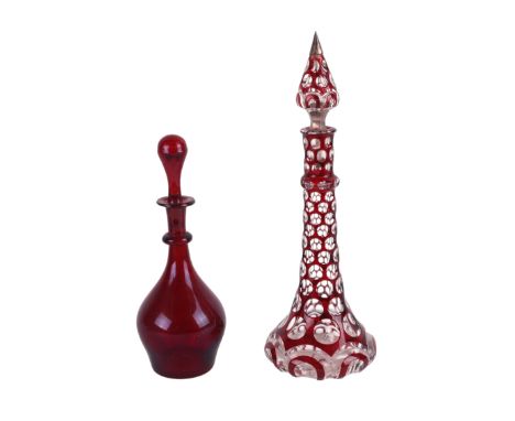 A large Victorian Bohemian ruby flashed glass table scent bottle, 30cms high; together with a smaller ruby glass scent bottle