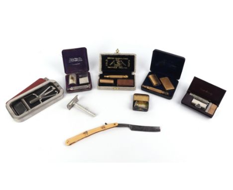 A quantity of vintage gentleman's razors to include Gillette, Laurel, and cut throat examples.