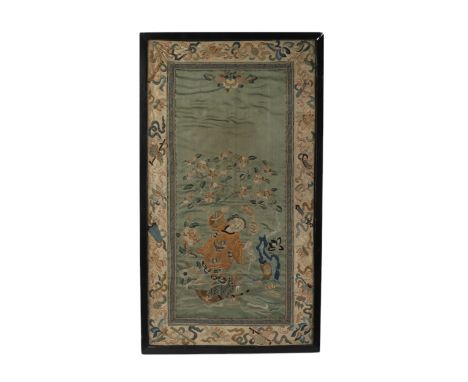 A Chinese silk embroidered panel depicting Liu Hai Chan standing on a three legged toad with auspicious cymbal border, framed
