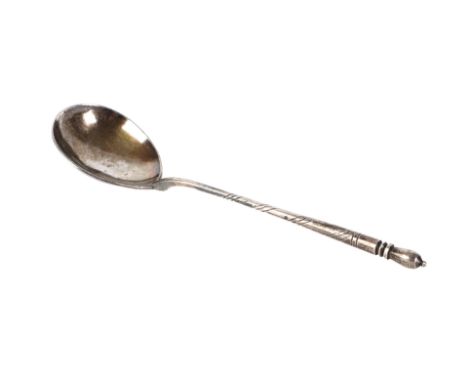 A Russian silver spoon with engraved decoration, 20cms long.
