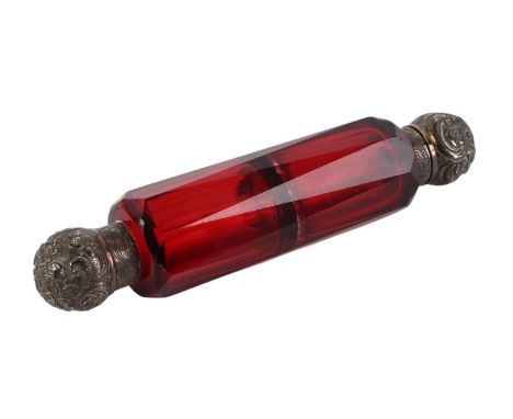 A Victorian unmarked silver topped double ended cranberry glass scent bottle, 13.5cms long.