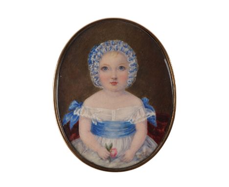 A Regency period portrait miniature on ivory depicting a young girl in a white dress with blue sash wearing a bonnet and hold