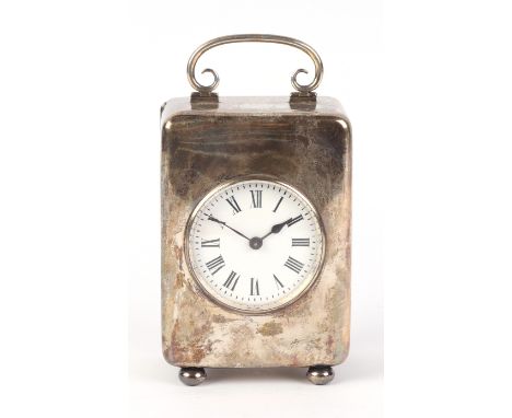 An Edwardian silver cased carriage time piece, the white enamel dial with Roman numerals, Birmingham 1905, 11cms high.