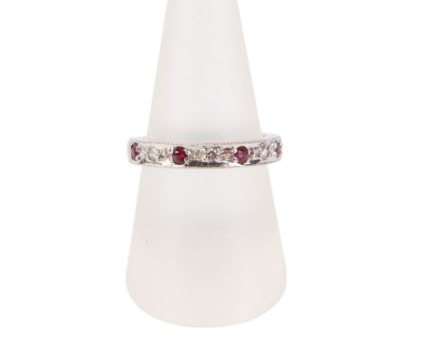 An 18ct white gold diamond and ruby set half eternity ring, approx UK size 'O', 5g.