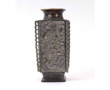 A Chinese bronze Cong type vase decorated with cranes amongst clouds, character mark to the underside, 21cms high.