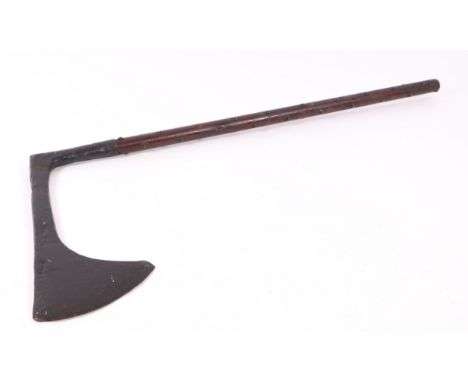 A large two-handled executioner's axe with large iron blade and studded shaft, blade head approx 42 by 22cms, total length 10