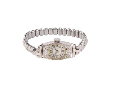 A 1920's ladies diamond set platinum cocktail watch, the silvered dial with Arabic numerals.