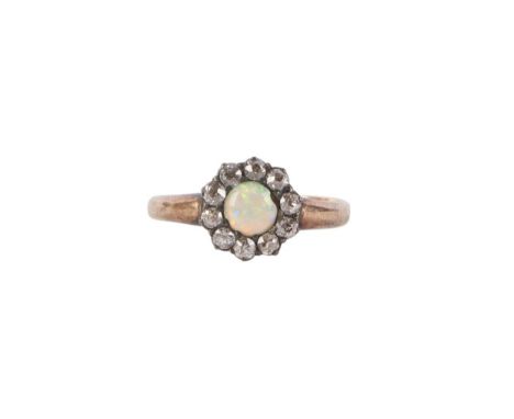 A yellow metal (tests as gold) opal and diamond cluster ring, approx UK size O, 2.8g.Condition ReportThere is a small chip to