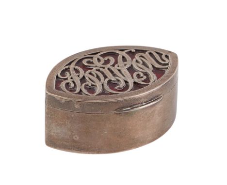 An Edwardian silver and red enamel navette shaped box with pierced letters 'Bonbon', London 1903, 6.5cms wide, 67g.