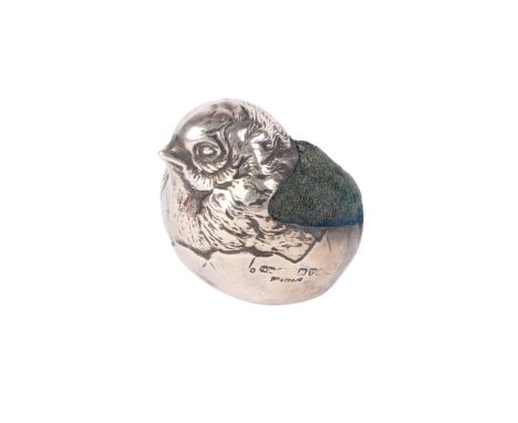 A Victorian novelty silver pin cushion in the form of a chick emerging from an egg, rubbed Chester hallmarks, possibly Sampso