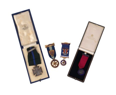 A Transport & General Worker's Union silver and enamel cased medallion; together with a silver gilt Rotary International meda