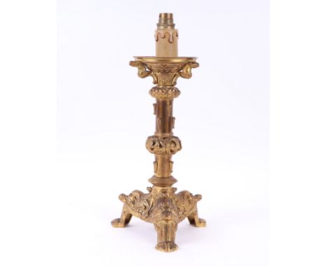 A gilt bronze table lamp in the form of a German medieval pricket candlestick, 37cms high.