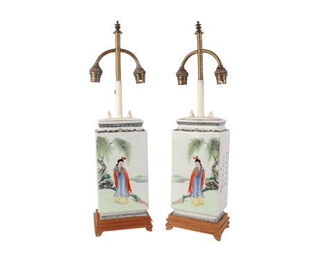 A pair of square form Chinese Republic style table lamps decorated with figures in a landscape and calligraphy, 29cms high ex