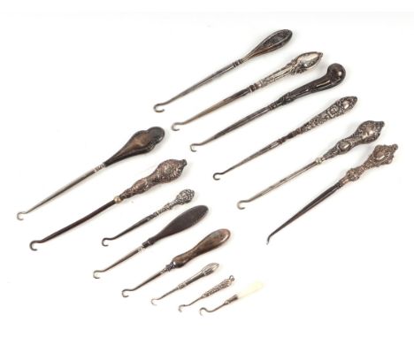A quantity of silver handled button hooks, various dates and makers marks.