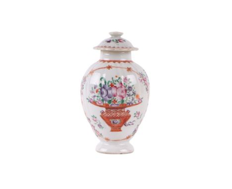 An 18th century Chinese famille rose tea caddy and cover decorated with flowers in a planter, 13cms high.Condition ReportGene