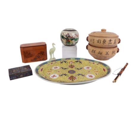A Chinese famille rose oval meat plate decorated with flowers on a yellow ground, 41cms wide; together with a Chinese bamboo 