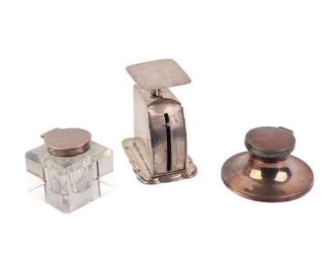 A set of silver postal scales, Birmingham 1919; together with a silver Capstan inkwell and a silver mounted glass inkwell (3)