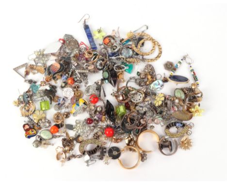 A large quantity of costume jewellery earrings to include yellow metal and silver examples.