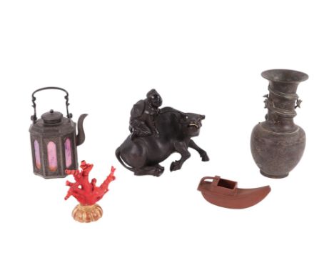 A Chinese bronze vase decorated with dragons, 25cms high; a Chinese Yixing pottery water dropper in the form of a boat, 16cms