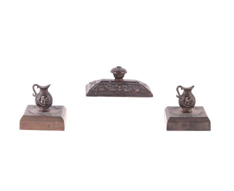 A pair of Smith & Wellstone Ltd Bonny bronze paperweights surmounted with jugs, 6.5cms wide; together with another paperweigh