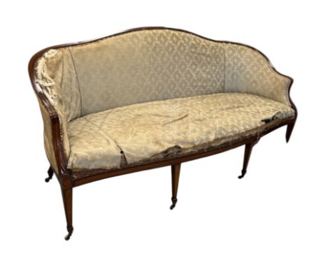 A late Victorian mahogany and satinwood serpentine sofa in the Hepplewhite style with kingwood banding, the moulded arms carv