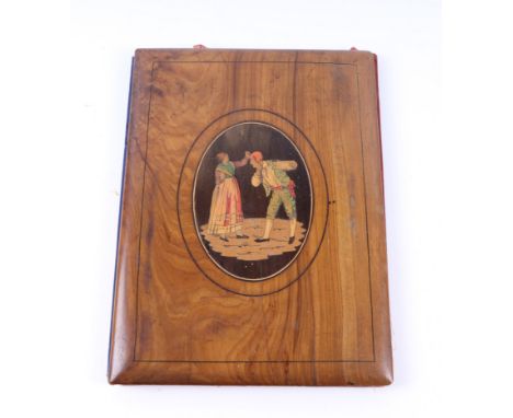 An Italian olivewood Sorrento ware desk blotter with oval inlaid panel depicting peasants, 19 by 26cms.