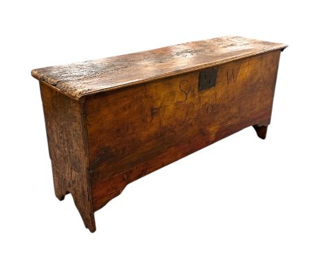 An 18th / 19th century elm six-plank coffer, the front panel with later carving 'SW 1781', approx 120cms wide.
