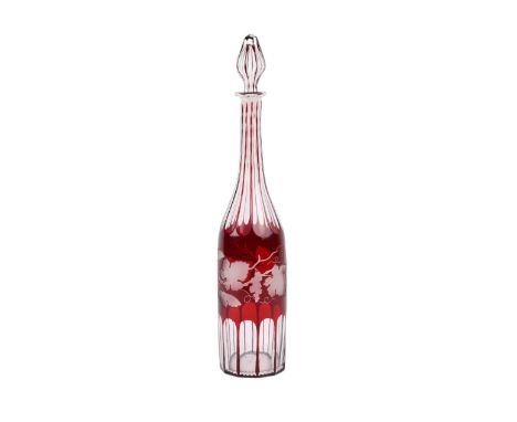 A Bohemian ruby flashed glass decanter and stopper with grape and vine engraved decoration, 39cms high.