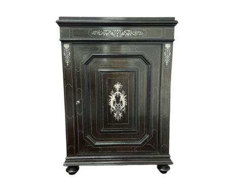 A 19th century Italian ebony and inlaid ivory Pier cabinet with single door and central panel inlaid with ivory stringing and