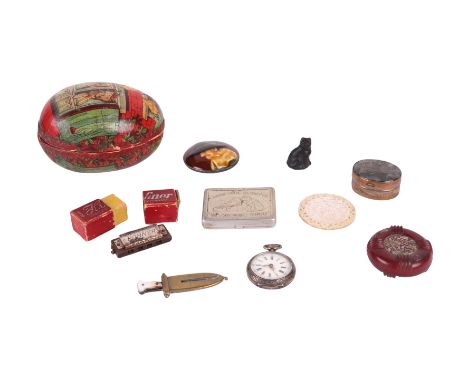 An early 20th century Rowntree's Chocolate Easter Egg shaped box containing a miniature cigar cutter in the shape of a dagger