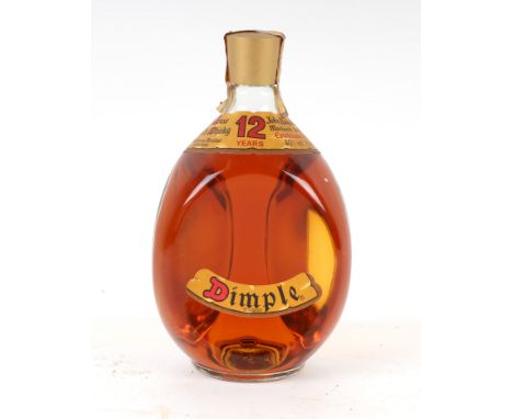 A bottle of John Haig 12 year old Dimple Deluxe Scotch whisky.