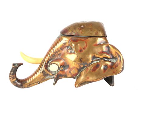 A late 19th century desk top inkwell in the form of an elephant's head, with Ivorine tusk, 16cms long.Condition ReportOne tus
