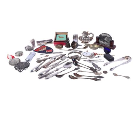A quantity of silver handled manicure tools; together with a silver topped scent bottle and other items.